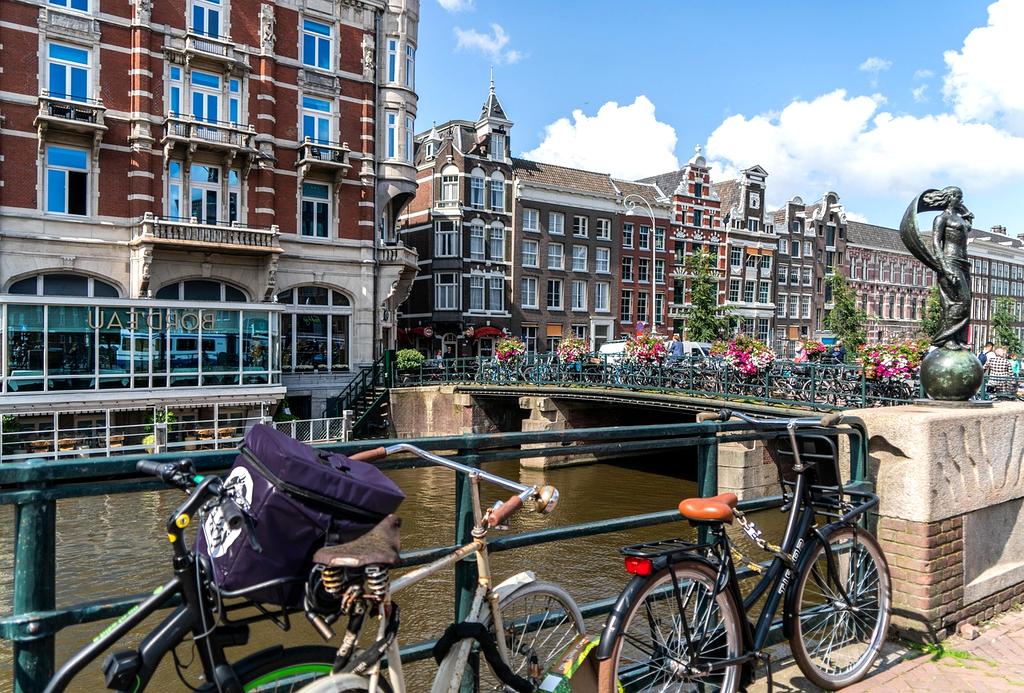Amsterdam canals and historic buildings on a sunny summer day