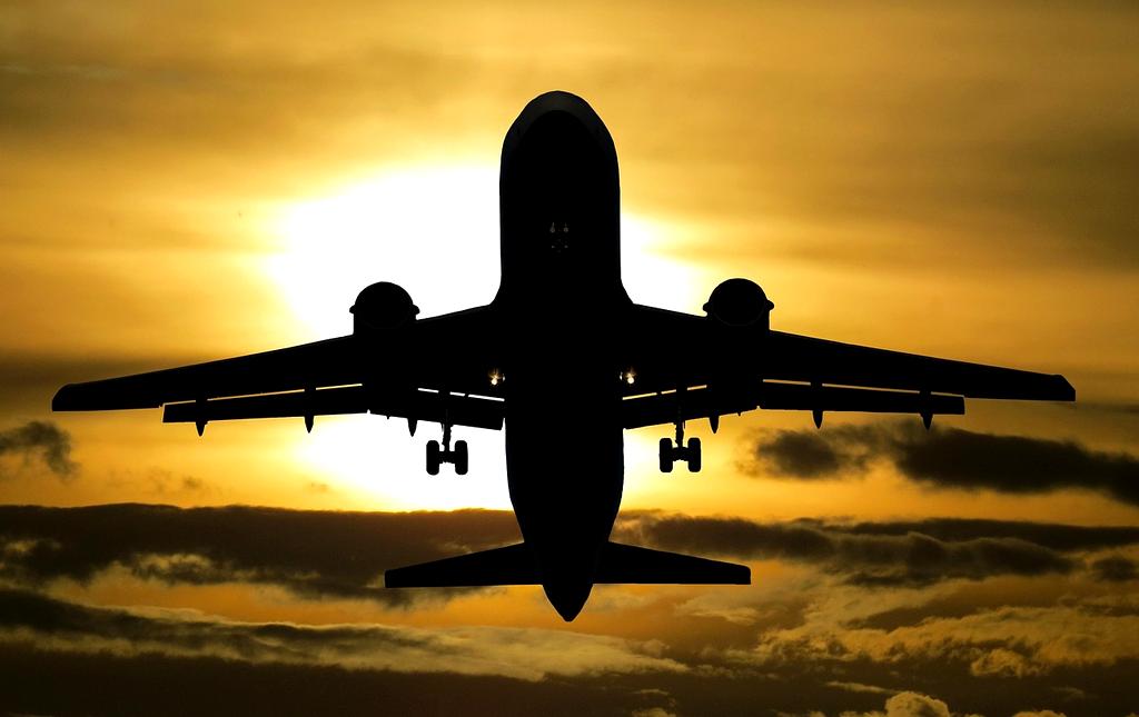 Solar-powered aircraft flying above clouds